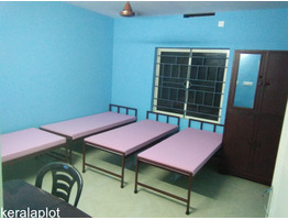 ERNAKULAM ,KAKKANADU - KOLLAMKUDIMUGAL 6.5 cent land with 5000 sqft G+2 Hostel Building for Sale