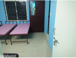 ERNAKULAM ,KAKKANADU - KOLLAMKUDIMUGAL 6.5 cent land with 5000 sqft G+2 Hostel Building for Sale